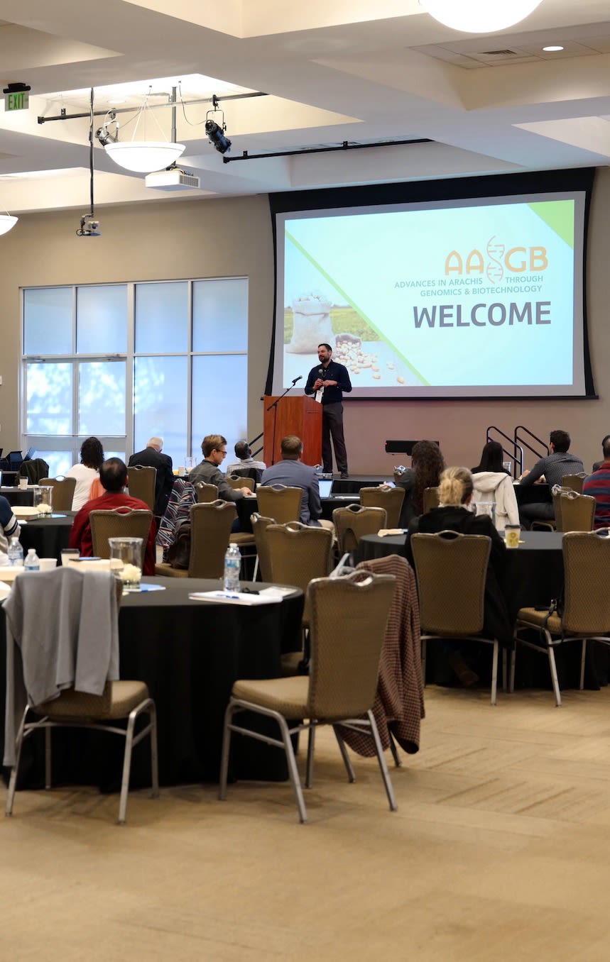 A man at a podium speaking in front of an audience